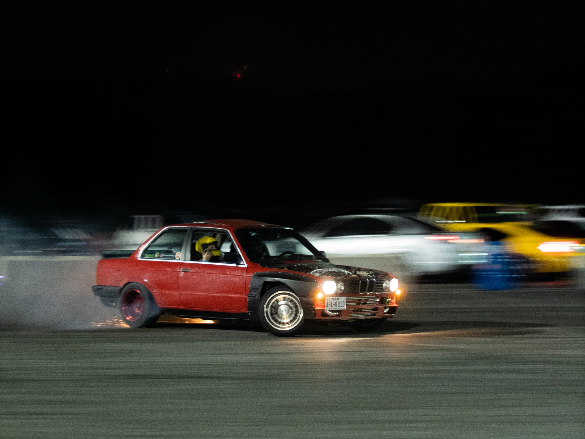 Red car drifting at Urban Racing at night