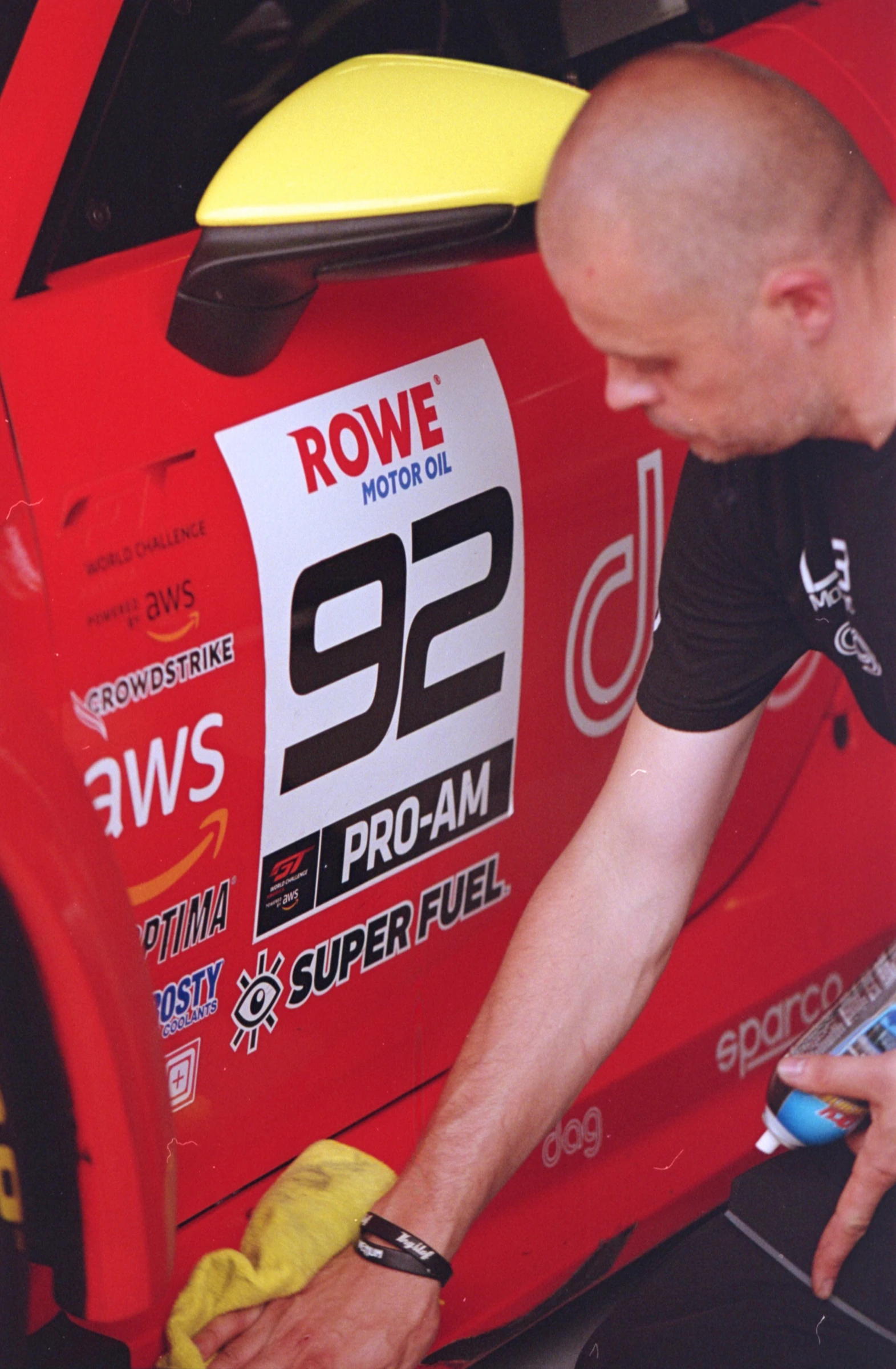 ROWE racing team working beside the race car at COTA