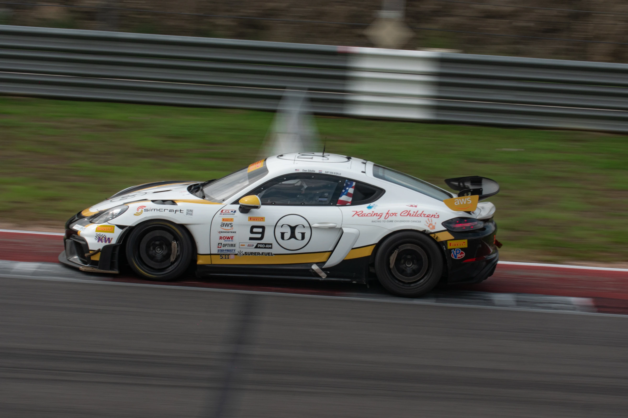 Porsche racing at COTA, captured with motion blur